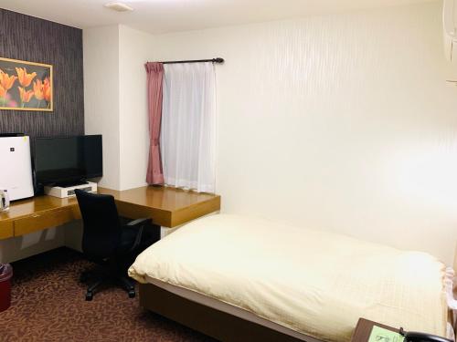 Imagen de la habitación del Hotel Business Raicho. Foto 6