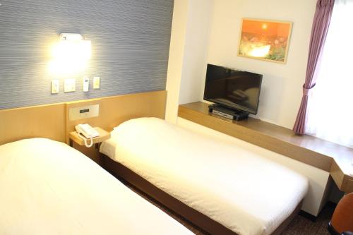 Imagen de la habitación del Hotel Business Raicho. Foto 7