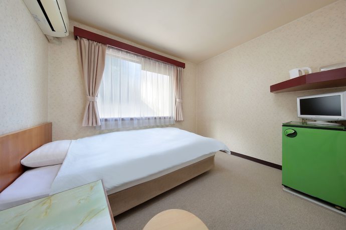 Imagen de la habitación del Hotel Business Ryokan Otamaya. Foto 11