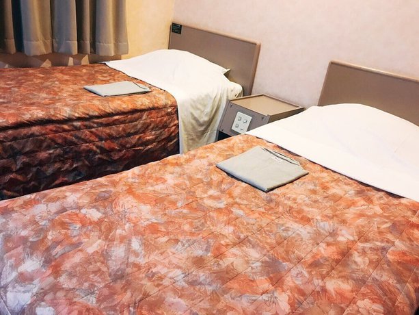 Imagen de la habitación del Hotel Business Sunshine Takamatsu. Foto 11