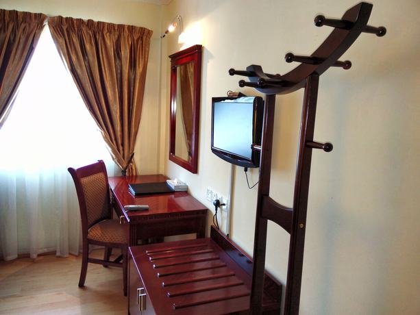 Imagen de la habitación del Hotel Bustani Hotel. Foto 9