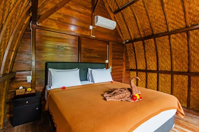 Imagen de la habitación del Hotel Butterfly Bungalows. Foto 24
