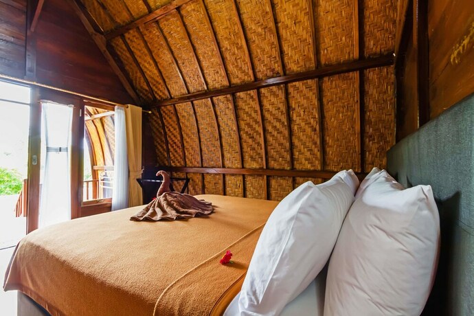 Imagen de la habitación del Hotel Butterfly Bungalows. Foto 27