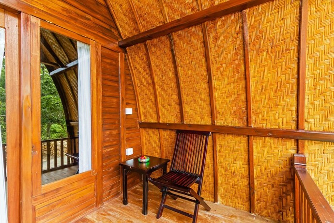 Imagen de la habitación del Hotel Butterfly Bungalows. Foto 28