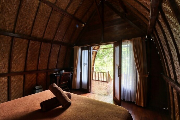 Imagen de la habitación del Hotel Butterfly Bungalows. Foto 33