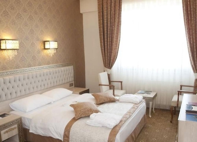 Imagen de la habitación del Hotel B&uuml;y&uuml;k Truva Oteli. Foto 5