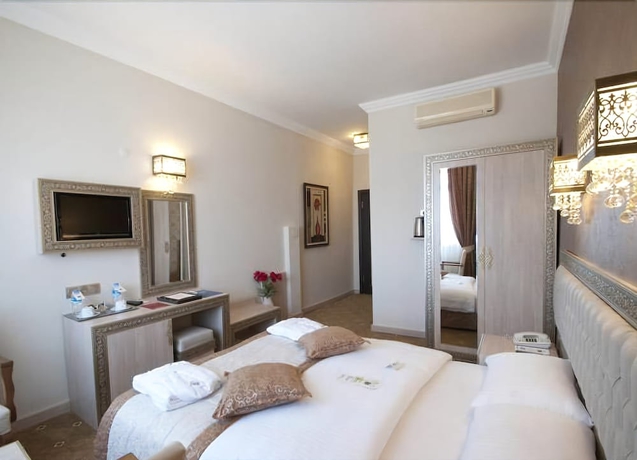 Imagen de la habitación del Hotel B&uuml;y&uuml;k Truva Oteli. Foto 6