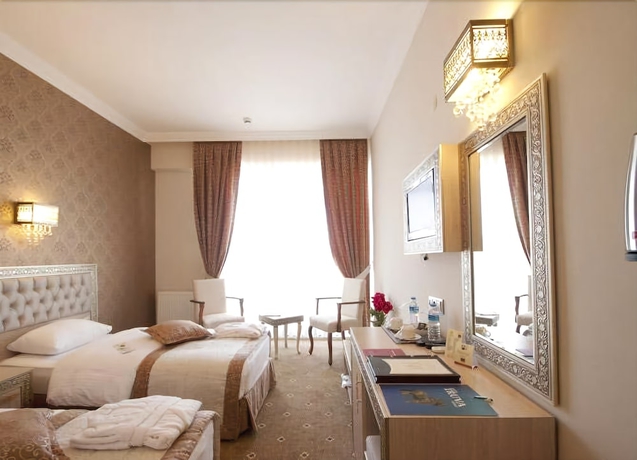 Imagen de la habitación del Hotel B&uuml;y&uuml;k Truva Oteli. Foto 7