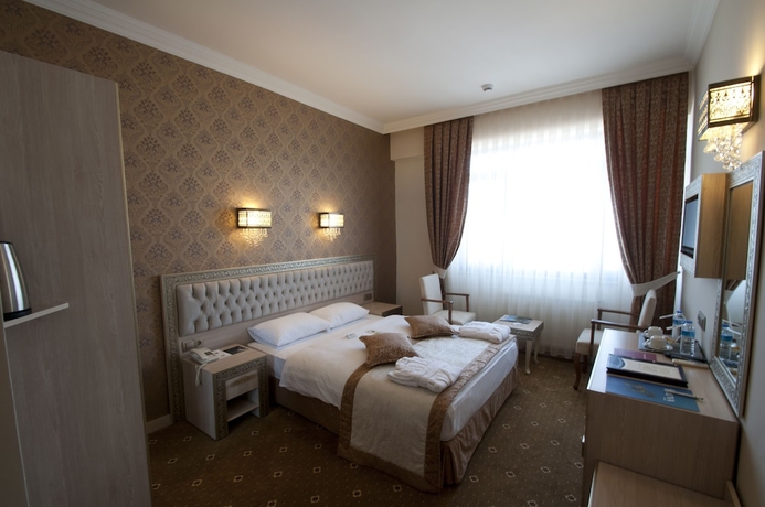 Imagen de la habitación del Hotel B&uuml;y&uuml;k Truva Oteli. Foto 9