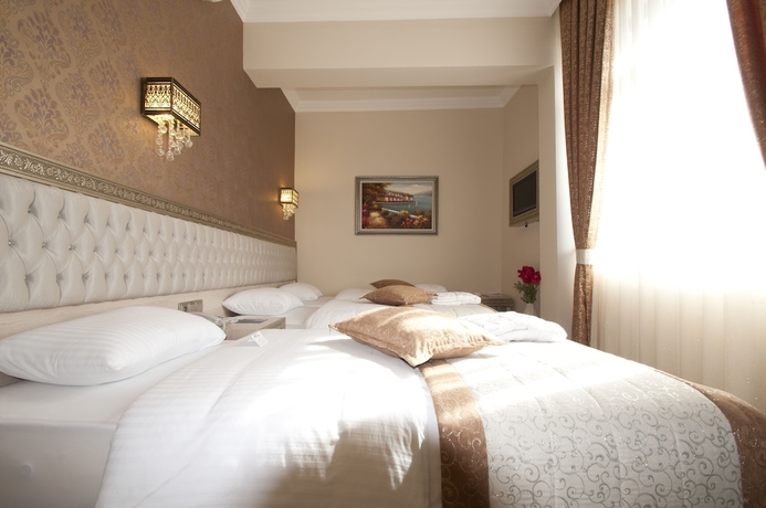 Imagen de la habitación del Hotel B&uuml;y&uuml;k Truva Oteli. Foto 10
