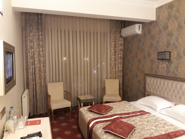 Imagen de la habitación del Hotel B&uuml;y&uuml;k Truva Oteli. Foto 12