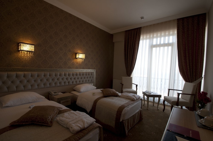 Imagen de la habitación del Hotel B&uuml;y&uuml;k Truva Oteli. Foto 13