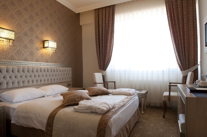 Imagen de la habitación del Hotel B&uuml;y&uuml;k Truva Oteli. Foto 14