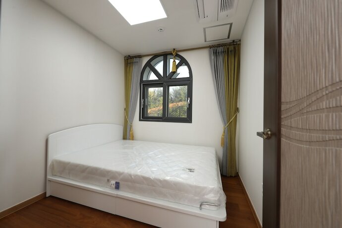 Imagen de la habitación del Hotel Buyeo Park Art Villas. Foto 14