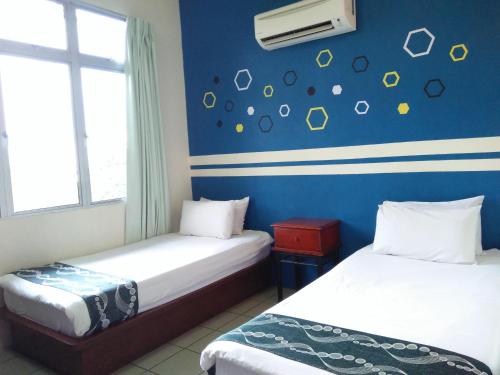 Imagen de la habitación del Hotel C, Jitra. Foto 7