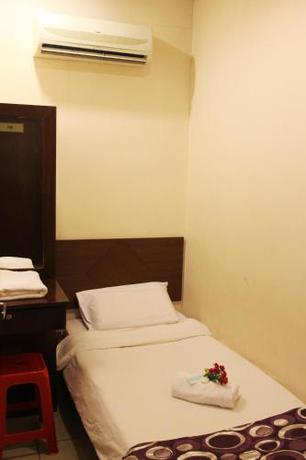 Imagen de la habitación del Hotel C, Jitra. Foto 10