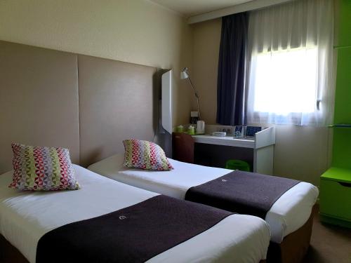 Imagen de la habitación del Hotel CAMPANILE ROISSY. Foto 11