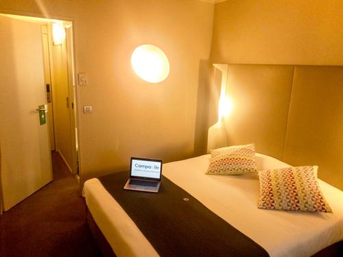 Imagen de la habitación del Hotel CAMPANILE ROISSY. Foto 16