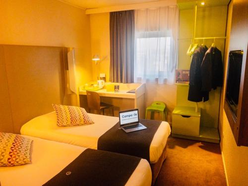 Imagen de la habitación del Hotel CAMPANILE ROISSY. Foto 17