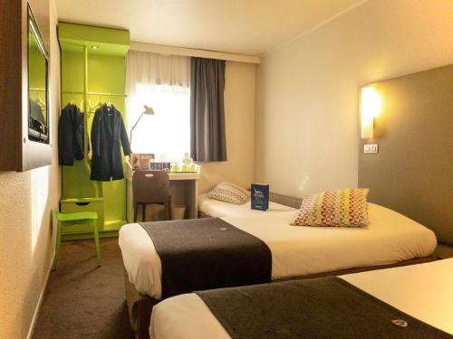 Imagen de la habitación del Hotel CAMPANILE ROISSY. Foto 18