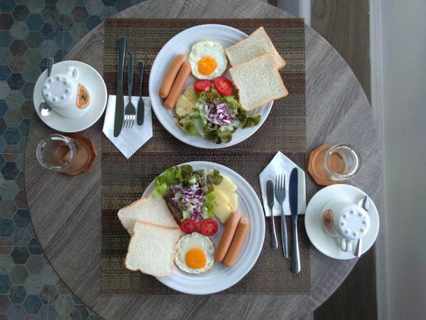 Imagen del bar/restaurante del Hotel CAPITAL O871 Baan Ping Kan Longstay. Foto 9