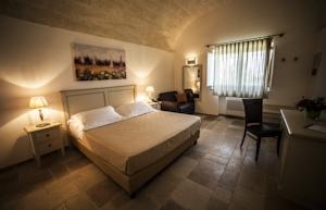Imagen de la habitación del Hotel CASALE DEL MURGESE COUNTRY RESORT. Foto 4