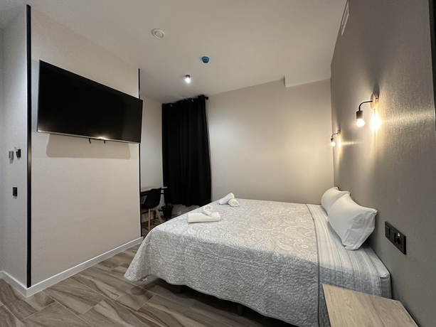 Imagen de la habitación del Hotel CC Opera Suites. Foto 18