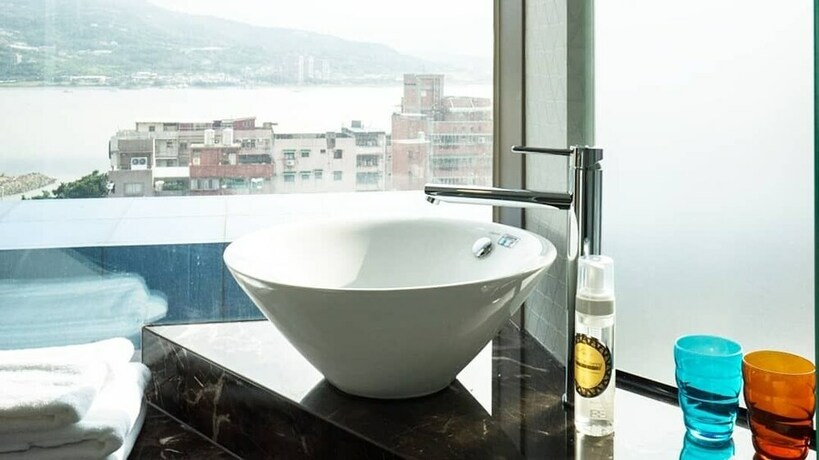 Imagen de la habitación del Hotel CHECKinn Express New Taipei Tamsui. Foto 19
