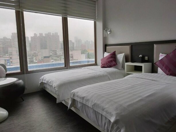 Imagen de la habitación del Hotel CHECKinn Express New Taipei Tamsui. Foto 21