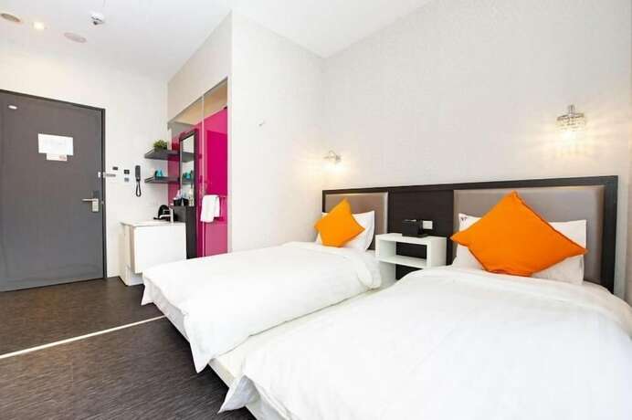 Imagen de la habitación del Hotel CHECKinn Express New Taipei Tamsui. Foto 23