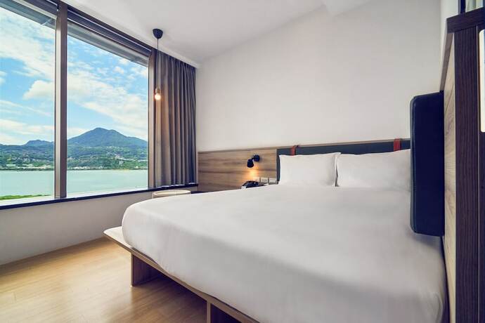 Imagen de la habitación del Hotel CHECKinn Express New Taipei Tamsui. Foto 30