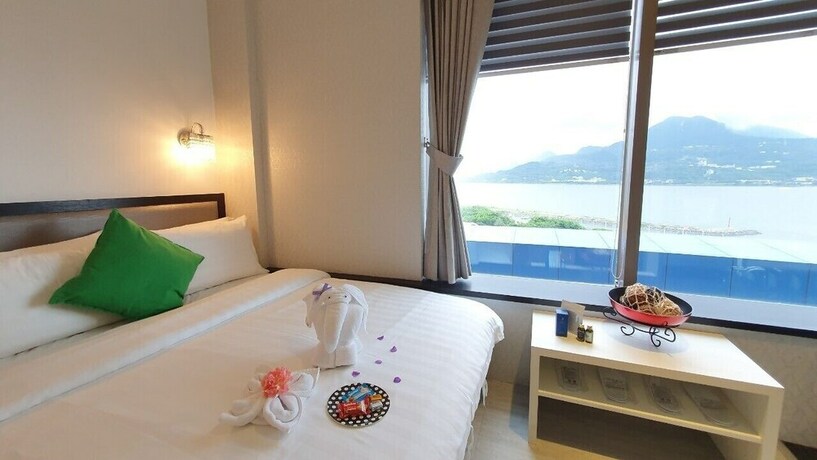 Imagen de la habitación del Hotel CHECKinn Express New Taipei Tamsui. Foto 32