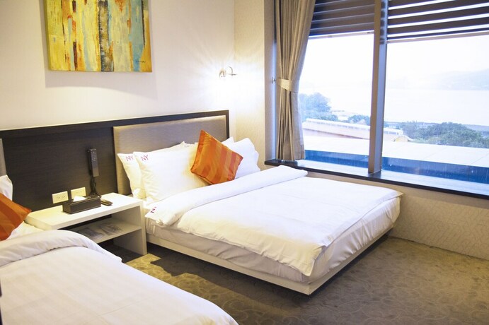 Imagen de la habitación del Hotel CHECKinn Express New Taipei Tamsui. Foto 35