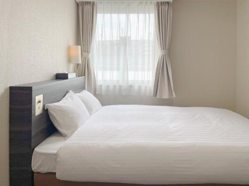 Imagen de la habitación del Hotel CHECKinn Osaka Shinimamiya. Foto 7