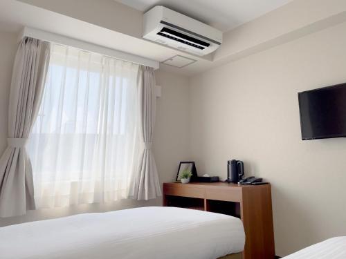 Imagen de la habitación del Hotel CHECKinn Osaka Shinimamiya. Foto 8