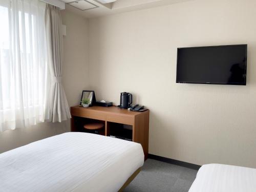 Imagen de la habitación del Hotel CHECKinn Osaka Shinimamiya. Foto 9