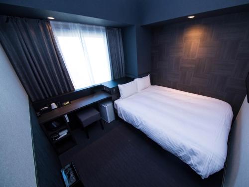 Imagen de la habitación del Hotel CHISUN STANDARD Osaka Shin-Imamiya. Foto 8