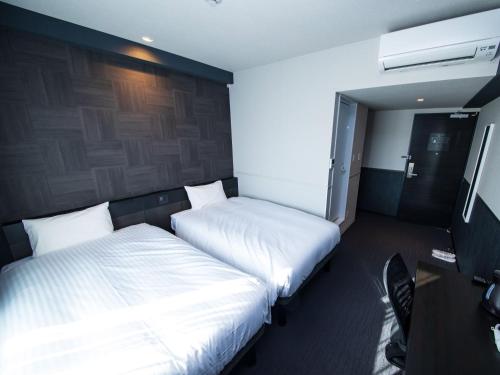 Imagen de la habitación del Hotel CHISUN STANDARD Osaka Shin-Imamiya. Foto 11