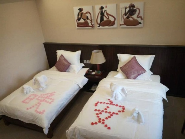 Imagen de la habitación del Hotel CHONPINES HOTEL ANSHUN TAIXIANG BAILI. Foto 6