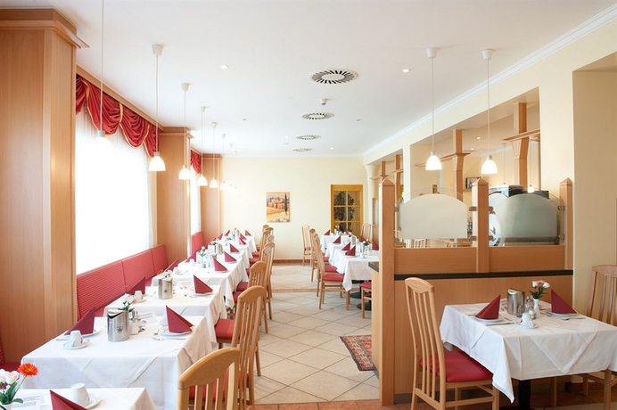 Imagen del bar/restaurante del Hotel CHRIZZ Rooms. Foto 2