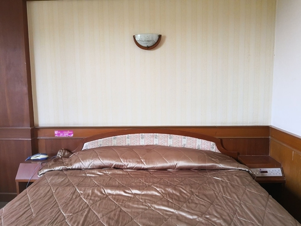 Imagen de la habitación del Hotel CL Garden Inn. Foto 8