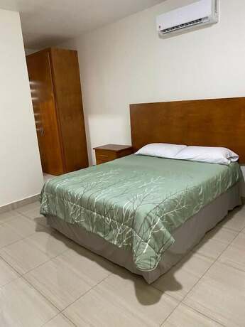 Imagen de la habitación del Hotel CMG Suites. Foto 10