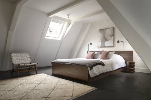 Imagen de la habitación del Hotel COMMUNE suites. Foto 12