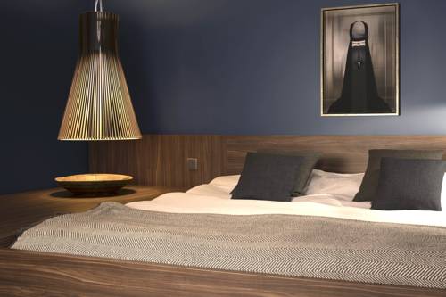 Imagen de la habitación del Hotel COMMUNE suites. Foto 13