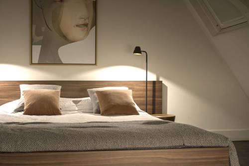 Imagen de la habitación del Hotel COMMUNE suites. Foto 14