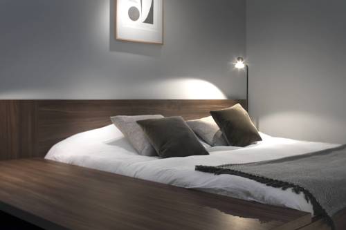 Imagen de la habitación del Hotel COMMUNE suites. Foto 16