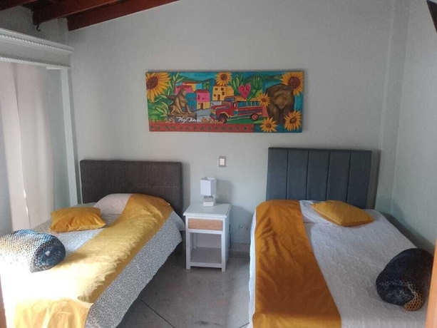 Imagen de la habitación del Hotel CORONA HOUSE. Foto 8