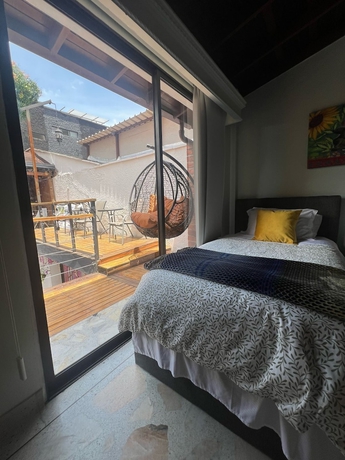 Imagen de la habitación del Hotel CORONA HOUSE. Foto 11