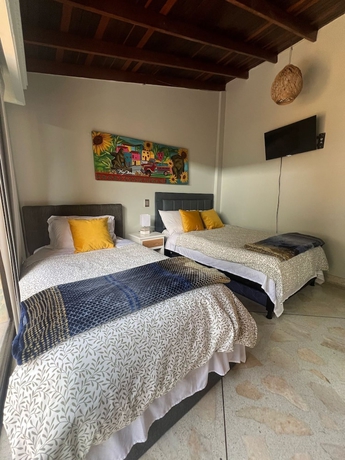 Imagen de la habitación del Hotel CORONA HOUSE. Foto 12