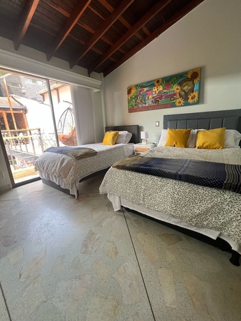 Imagen de la habitación del Hotel CORONA HOUSE. Foto 13